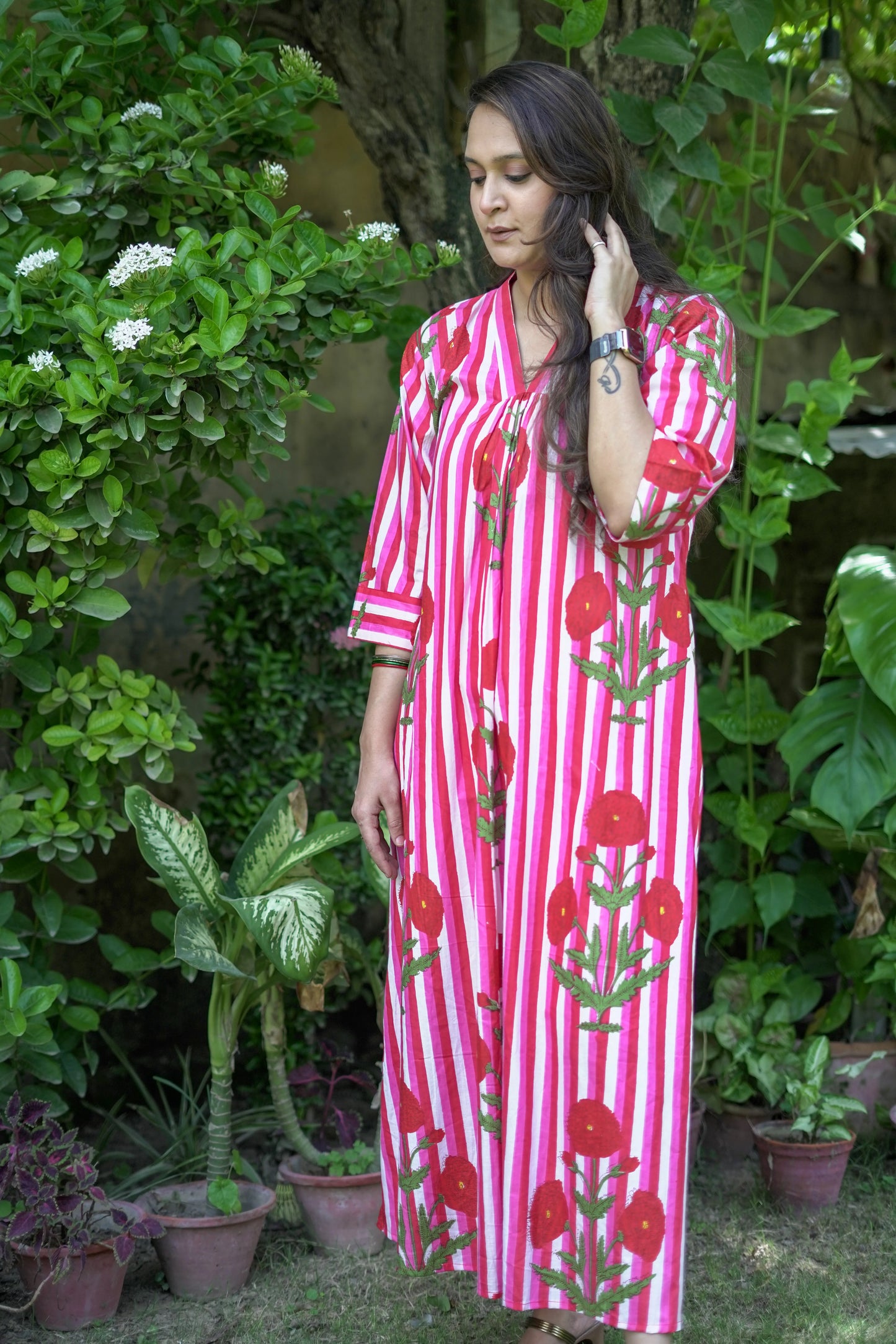 Bold Pink Dress with Stripes and Motifs