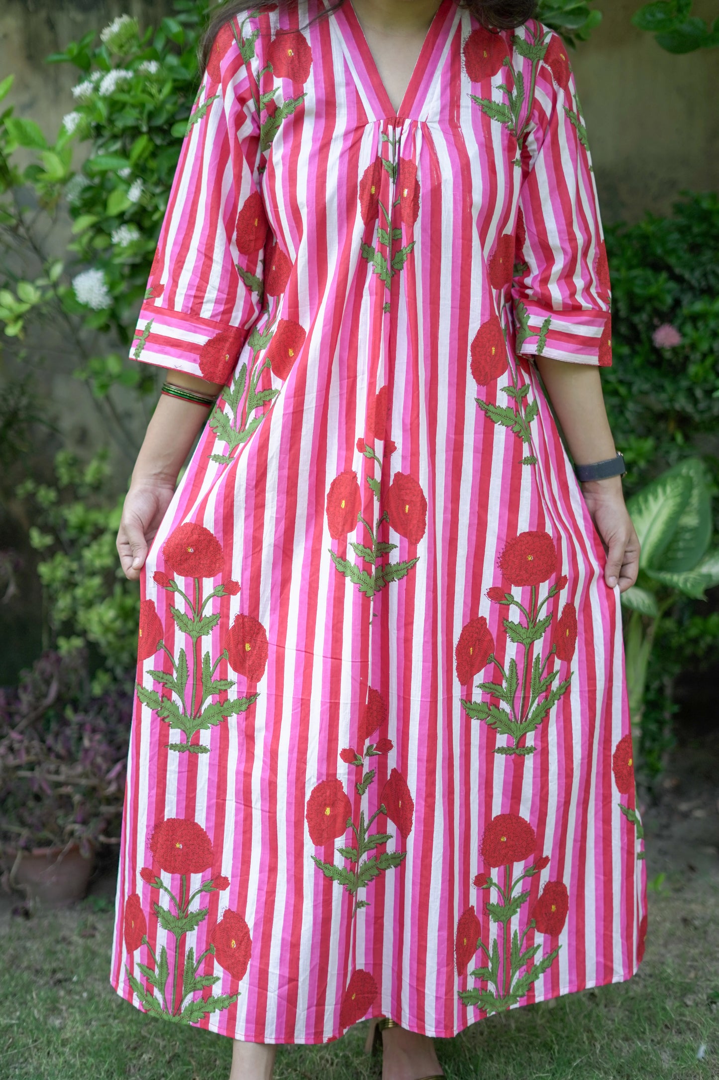 Bold Pink Dress with Stripes and Motifs