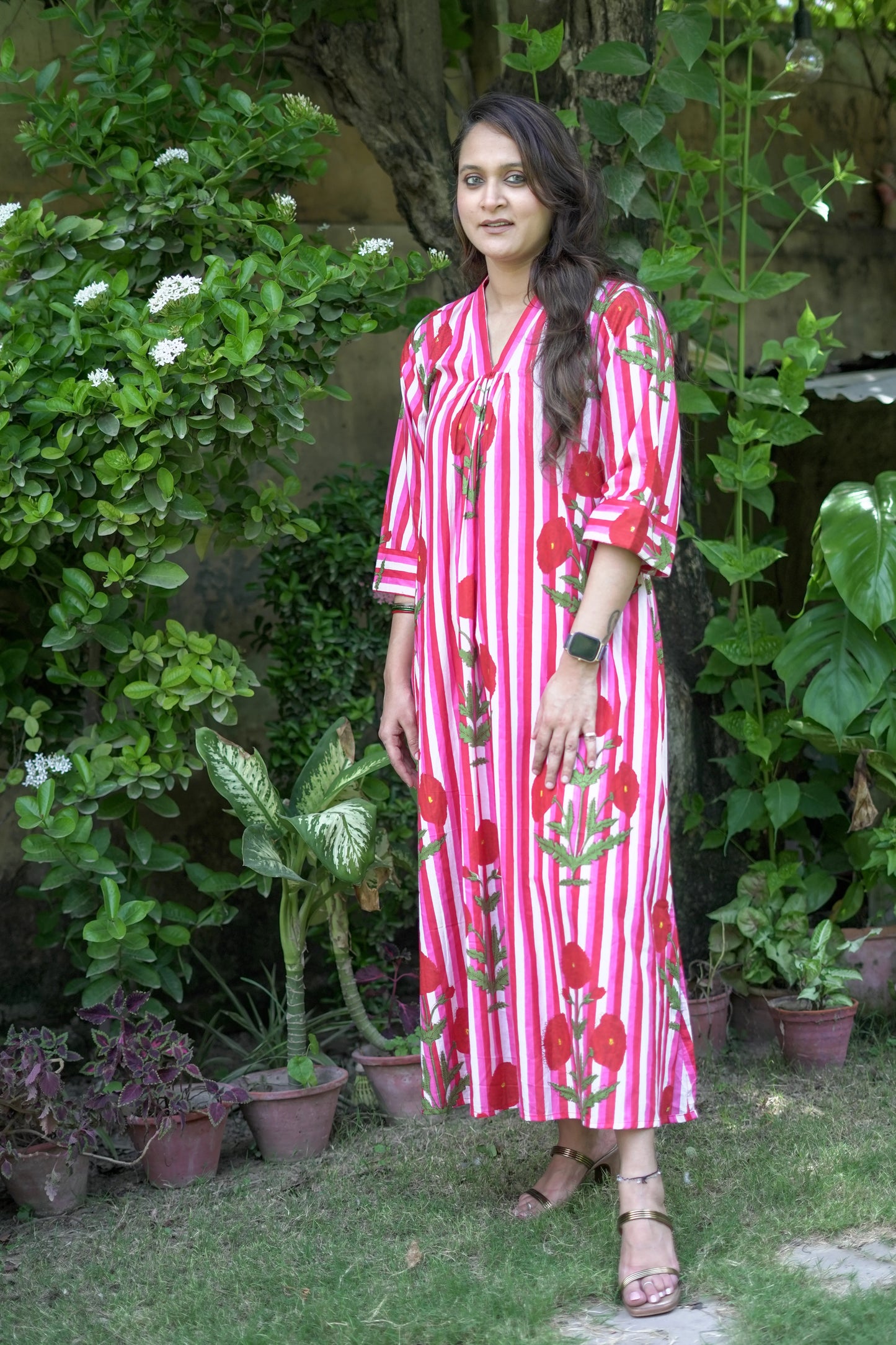 Bold Pink Dress with Stripes and Motifs