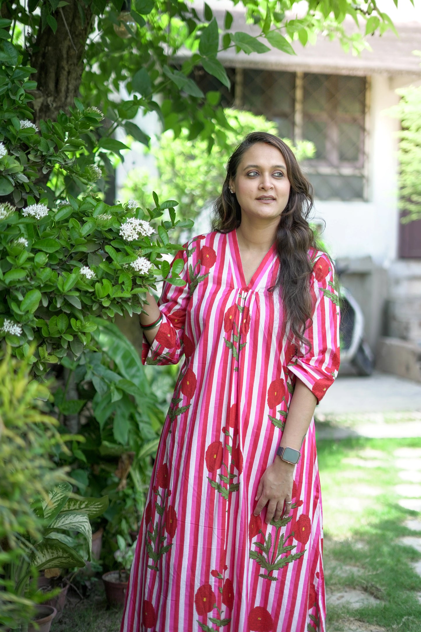 Bold Pink Dress with Stripes and Motifs